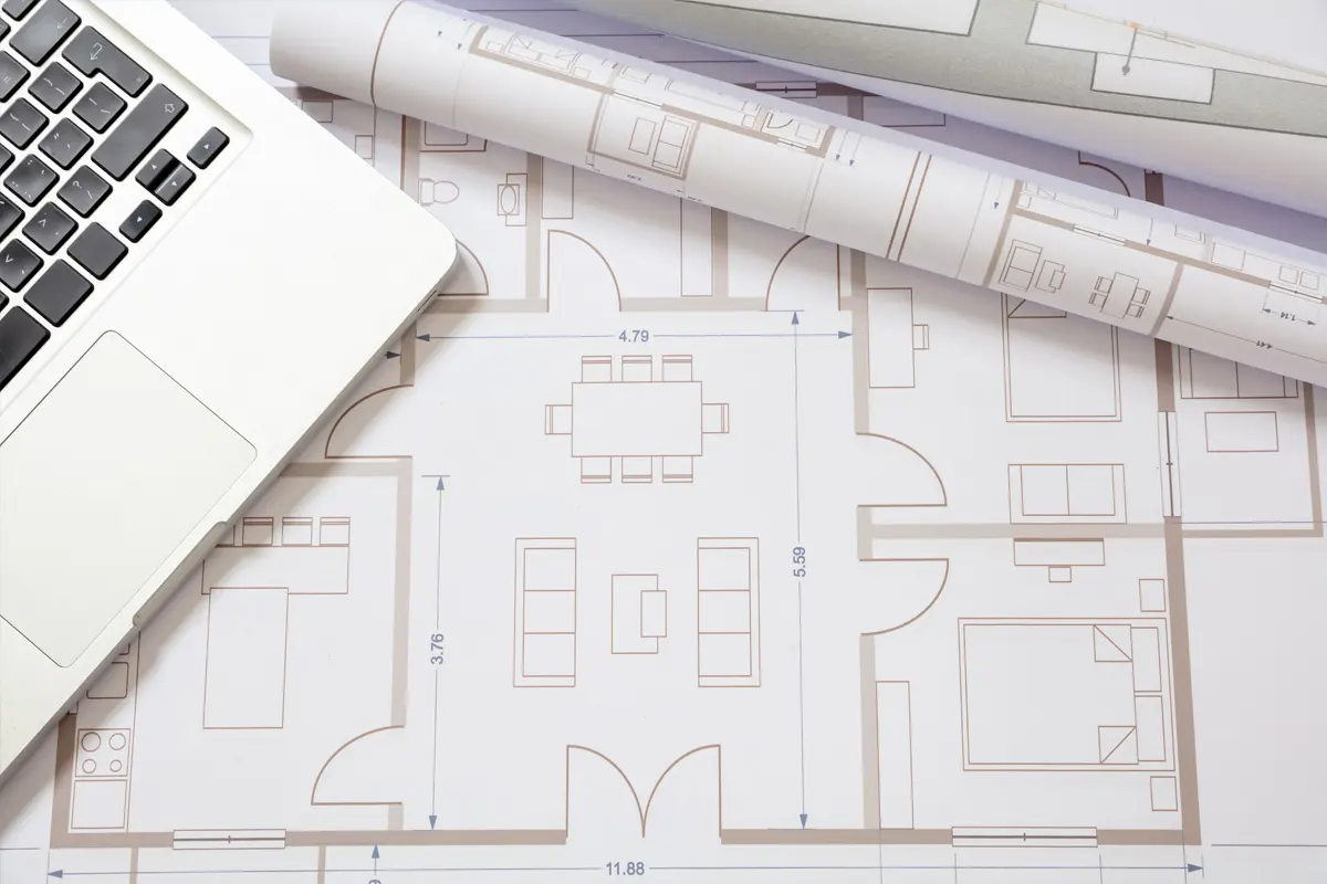 Architectural blueprint laid out on a clean, white surface