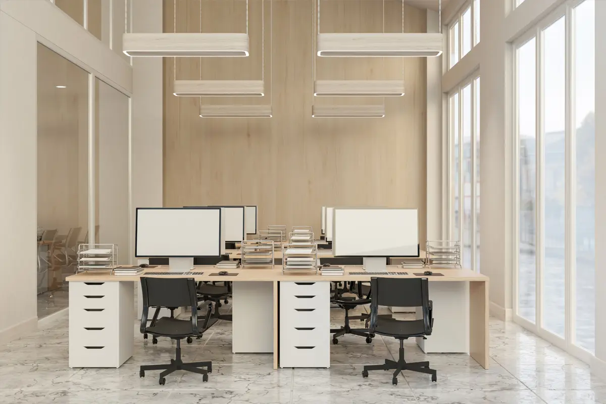 A modern office setup including several desks with computers.
